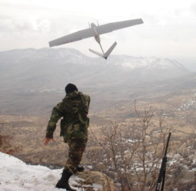 Man launching w:Bayraktar Mini UAV