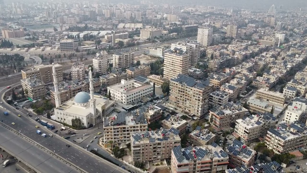 Damascus from above: Drone footage reveals a city scarred by war .  Brutal conflict, regime collapse, and external intervention—witness the evolving narrative.  See the aerial story. Click now!