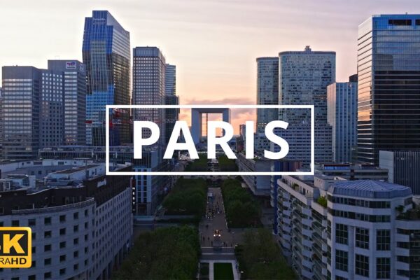 Soar above Paris!  Drone footage unveils iconic landmarks & hidden gems.  Experience the City of Light like never before.  Hit play!